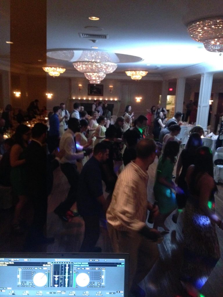 Happy people dancing at a wedding reception