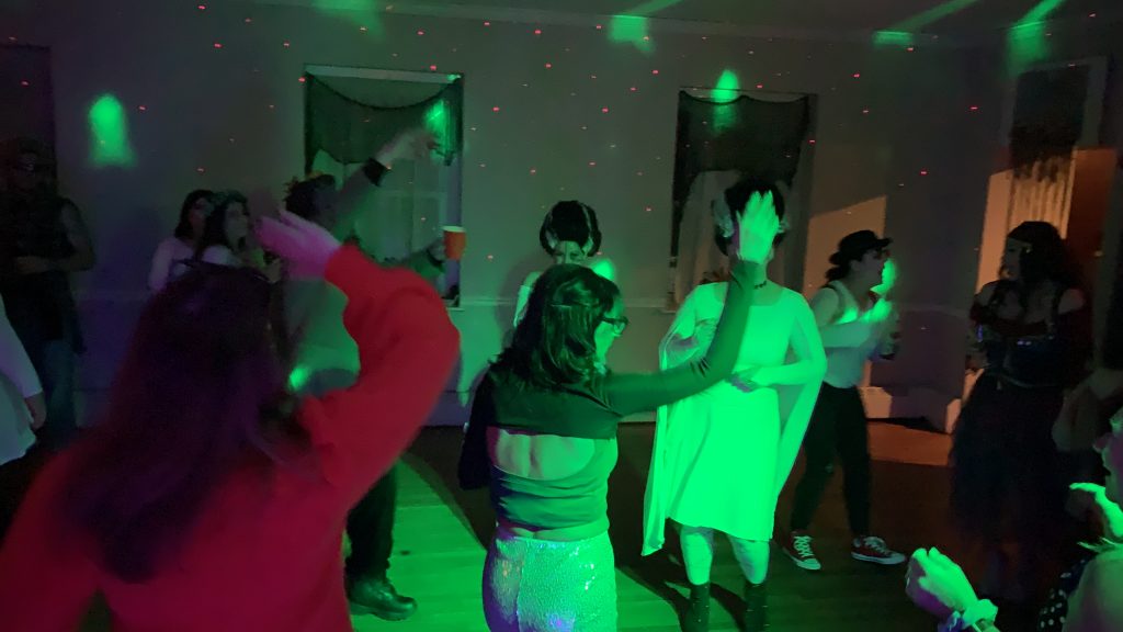 Happy people dancing at a party